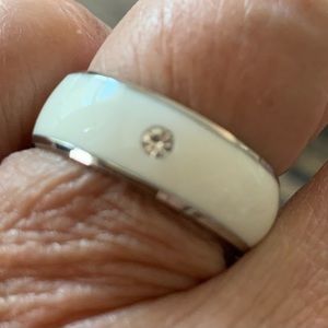 White band with Zirconia diamond.  Size 10